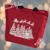 Red with winter scene of six snow-covered Christmas trees, with red ornaments. Above trees is Santa and his sleigh, pulled by 8 reindeer